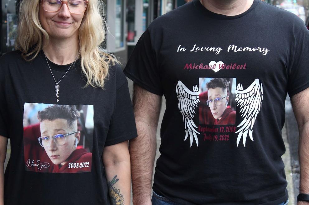 Amber and David Weilert wearing shirts in memory of their won, Michael
