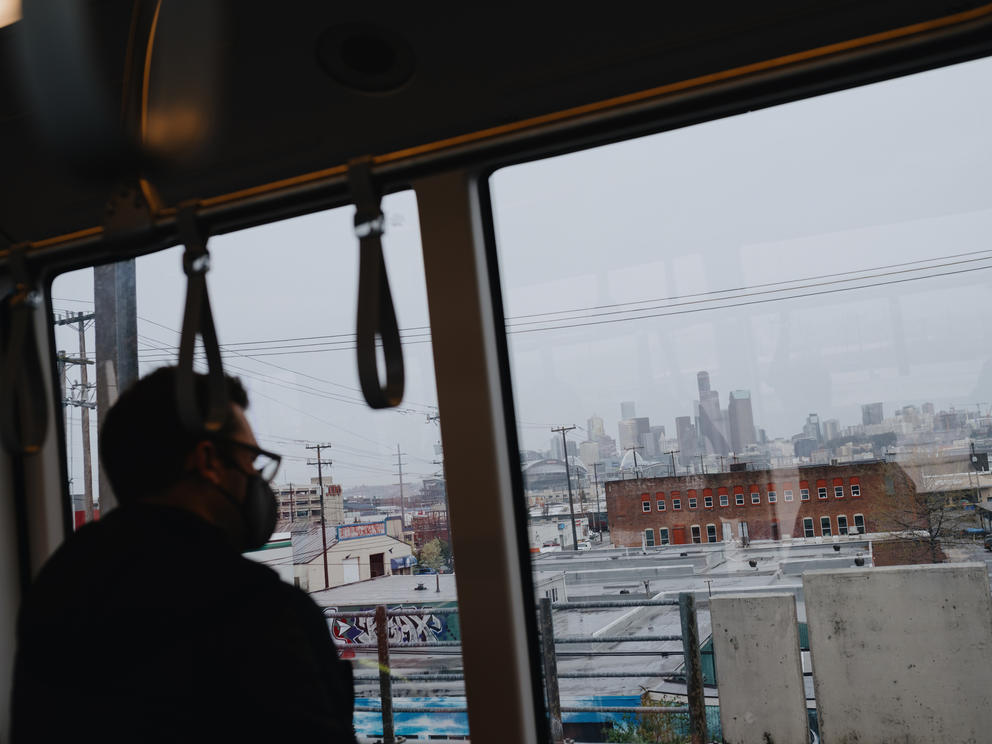 Seattle’s skyline seen on a grey day from SoDo on a Link Light Rail train.