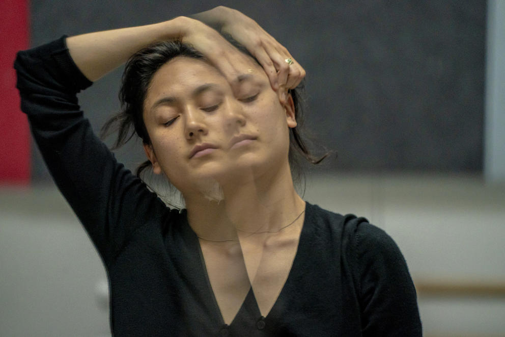 dancer Leah Terada is reflected in a studio mirror while rehearsing