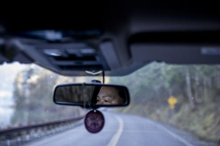 Dawn's eyes in the rearview mirror