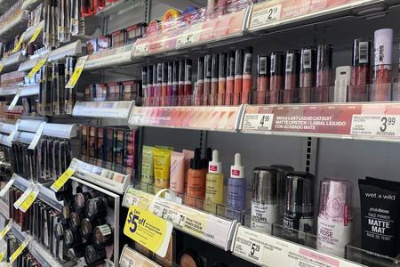 A close up of various cosmetic products on a drug store shelf