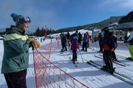 General manager Rikki Cooper keeps an eye on the Great White Express lift line at White Pass Ski Resort