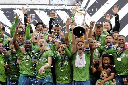 Seattle Sounders celebrate with MLS Cup trophy