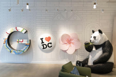 An art installation featuring a large “I (heart) DC” button and a panda statue