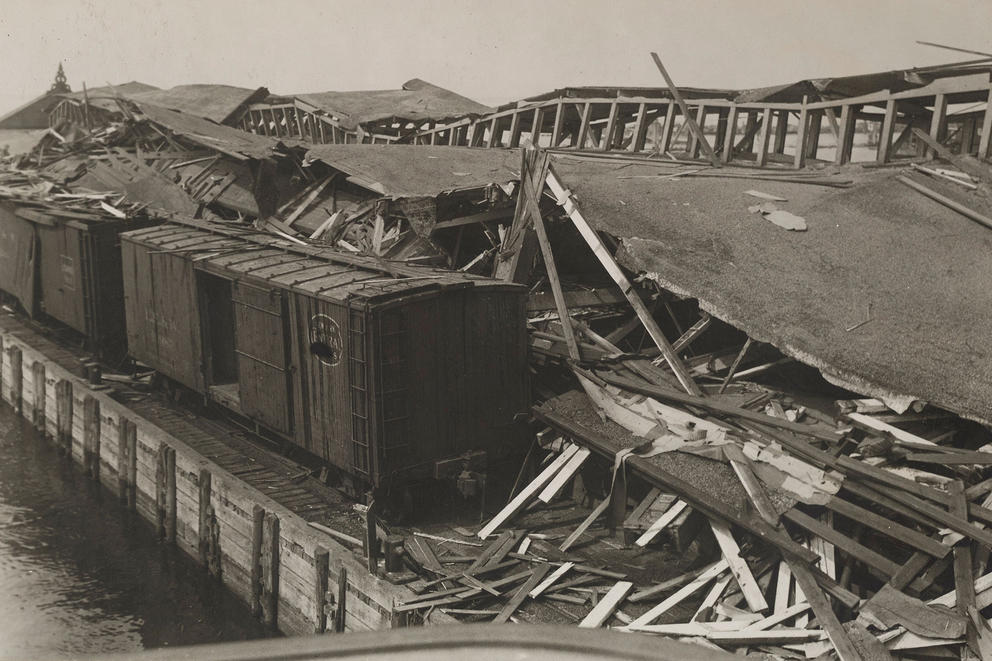 Image of destroyed docks and trains.