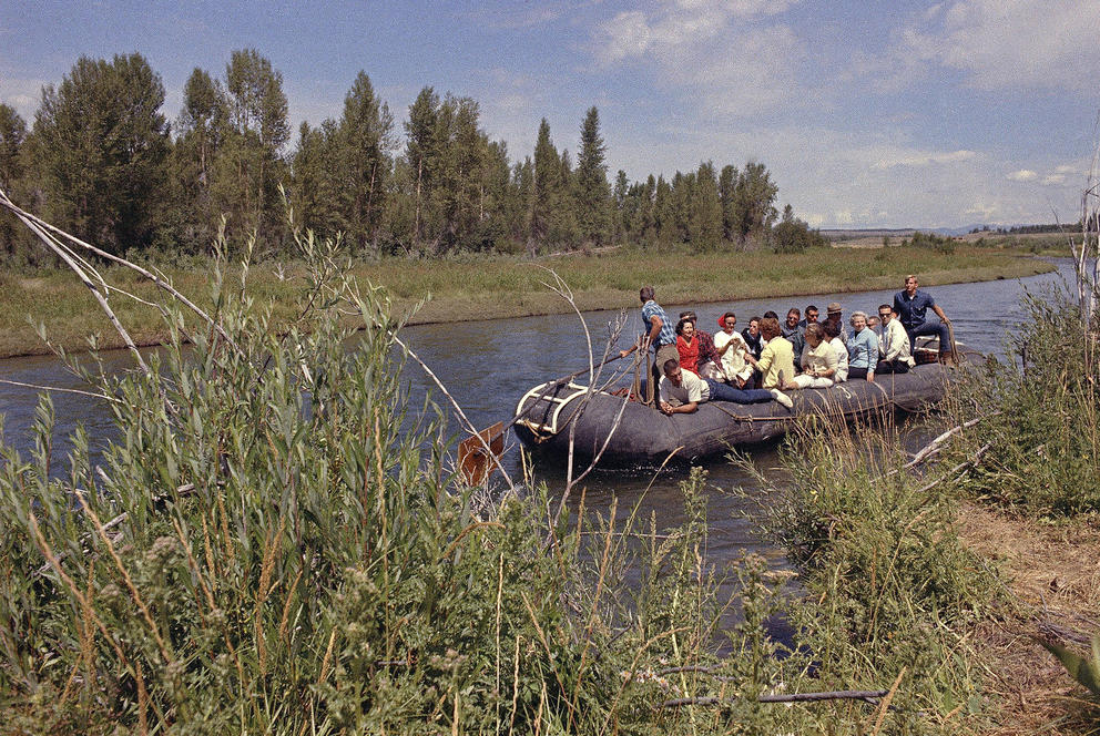 Mrs. Lyndon B. Johnson, distant with Secretary of Interior, Stewart Udall and others, in boat