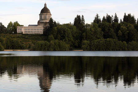 Washington's state capitol building is seen across Capitol Lake. Credit: Matt M. McKnight/Crosscut