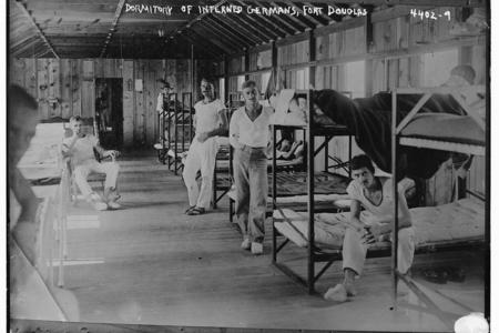 Archival image of men in a bunkhouse
