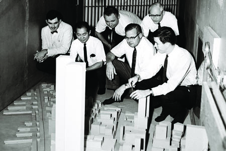 old photo of architects with models of the World Trade Center