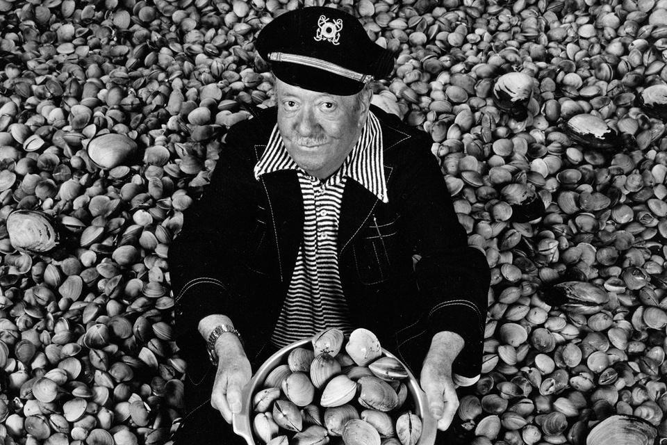Ivar Haglund surrounded by acres of clams